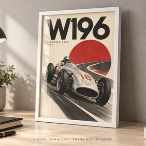 May include: A framed poster featuring a vintage silver Mercedes-Benz W196 race car from 1954. The artwork displays the text W196, Mercedes-Benz, and 1954, with a large red circle background and the race car driving on a track with the number 18.