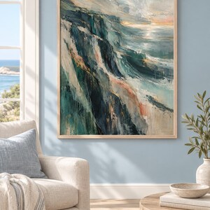 May include: A rectangular framed wall art piece featuring an abstract oil painting of a coastal cliffside. The artwork displays deep navy, teal, and forest green tones blended with soft cream, white, and muted peach highlights in a textured brushstroke style.