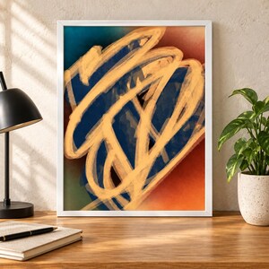 May include: A framed rectangular wall art piece featuring a bold, abstract composition of thick, sweeping golden-yellow brushstrokes layered over a deep blue, teal, and burnt orange gradient background, enclosed within a simple white frame.