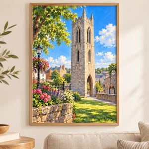 May include: A framed wall art print depicting a tall, weathered stone bell tower standing in a sunlit park. The scene features a bright blue sky with white clouds, vibrant pink and purple flowers, a black lamp post, and green trees.