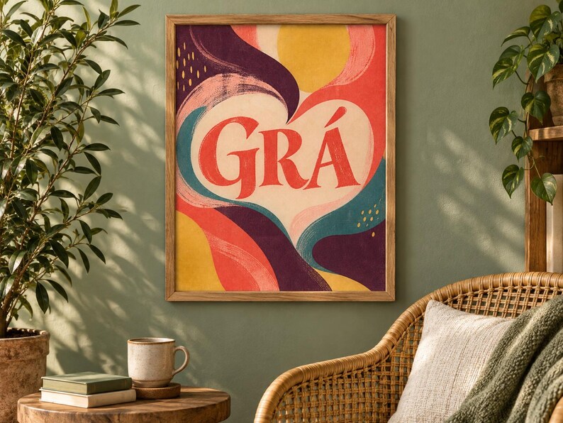 May include: A rectangular framed wall art print featuring a central white heart shape containing the red text GR&Aacute;. The background consists of abstract, flowing shapes in shades of yellow, red, deep purple, and teal with visible brushstroke textures.