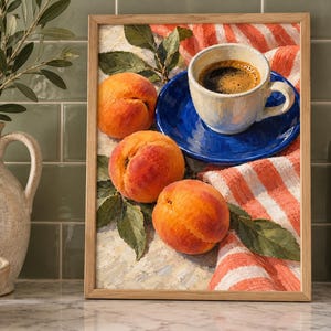 May include: A framed painting depicting three ripe orange peaches with green leaves resting on a white surface next to a white coffee cup on a vibrant blue saucer, all placed upon a folded white and orange striped cloth with a textured finish.