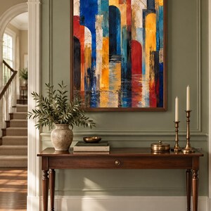 May include: A rectangular wall art piece in a dark wood frame featuring an abstract composition of vertical stripes and arched shapes in vibrant shades of blue, yellow, red, and black with textured brushstrokes and a reflective effect at the base.