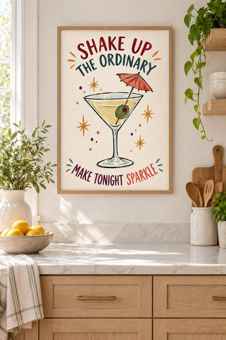 May include: A framed wall art print featuring a martini glass with an olive and a small red cocktail umbrella. The text reads SHAKE UP THE ORDINARY and MAKE TONIGHT SPARKLE, surrounded by yellow starbursts and small colorful dots on a cream background.