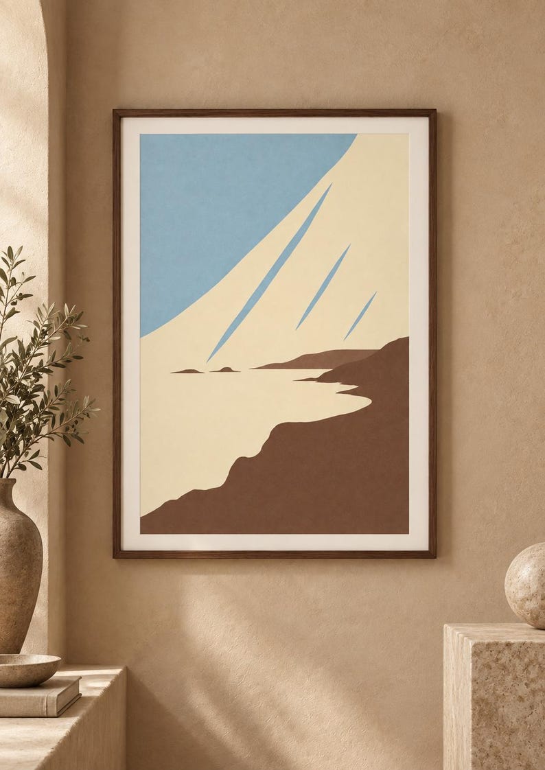May include: A framed wall art print featuring a stylized landscape with a light blue sky, a cream-colored expanse, and dark brown landforms. The composition uses clean, flat shapes to depict a coastal scene with sharp, diagonal blue lines.