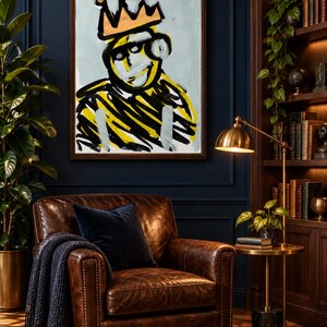 May include: A rectangular framed wall art piece featuring a stylized, abstract portrait of a figure wearing a peach-colored crown. The artwork uses bold, expressive black and yellow brushstrokes against a light blue background, set in a dark frame.
