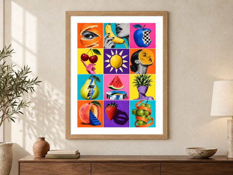 May include: A framed wall art print featuring a grid of twelve colorful surrealist collages. The images combine fruits like oranges, cherries, bananas, pears, peaches, strawberries, and grapes with human features, geometric shapes, and vibrant backgrounds.