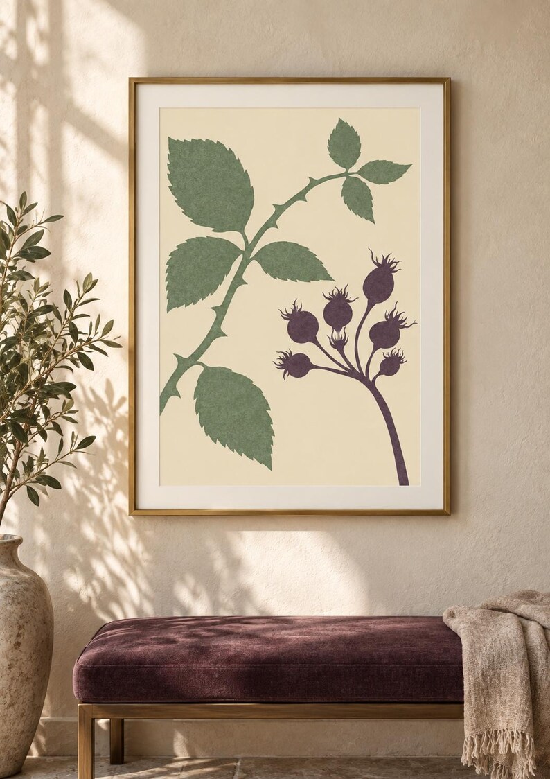 May include: A framed wall art print featuring a botanical illustration on a cream background. The artwork displays a green thorny stem with serrated leaves on the left and a cluster of dark purple rose hips on the right, all enclosed in a gold frame.