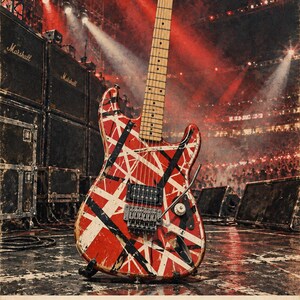 May include: An electric guitar with a red, white, and black striped body, a maple neck, and a tremolo bridge. The text below reads EDDIE VAN HALEN Frankenstrat 1977. The guitar is positioned against a concert stage background with red lighting.