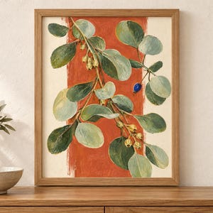 May include: A framed wall art print featuring a botanical illustration of a leafy branch with green foliage, small pale yellow buds, and a single bright blue berry. The branch is set against a vertical, textured terracotta orange stripe.
