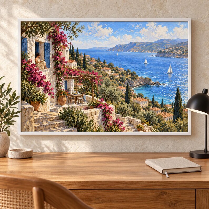 May include: A framed wall art print depicting a Mediterranean coastal scene with a white stone villa, vibrant pink bougainvillea flowers, a terrace with a table and chairs, and a blue sea with sailboats under a bright sky with scattered clouds.