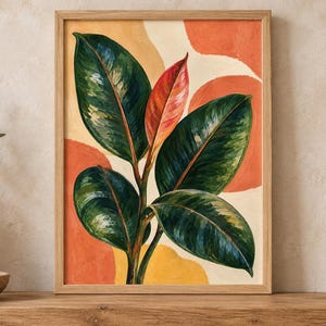 May include: A framed wall art print featuring a rubber plant with large, glossy dark green leaves and one central vibrant red leaf. The background consists of abstract, rounded shapes in shades of warm orange, yellow, and cream, set in a light wood frame.