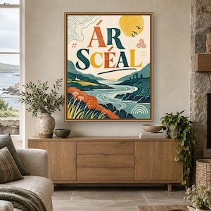 May include: A framed rectangular wall art print featuring a landscape illustration with a winding river, rolling hills, and a yellow sun. The text "&Aacute;R SC&Eacute;AL" is printed in large, bold, dark blue letters at the top center of the artwork.