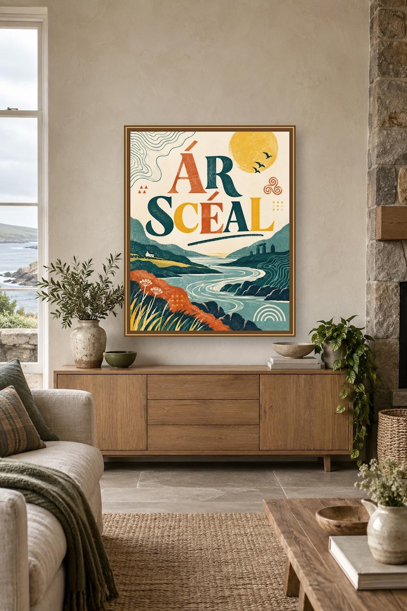 May include: A framed rectangular wall art print featuring a landscape illustration with a winding river, rolling hills, and a yellow sun. The text "&Aacute;R SC&Eacute;AL" is printed in large, bold, dark blue letters at the top center of the artwork.