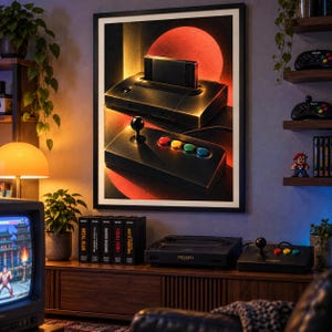 May include: A framed wall art print depicting a black Neo Geo game console with a cartridge inserted and a joystick controller, set against a dark background with a large red circle. The artwork features a retro aesthetic with warm lighting.