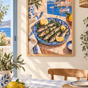 May include: A framed wall art print depicting a Mediterranean coastal scene with a plate of grilled sardines garnished with parsley and lemon slices, set on a stone ledge overlooking a blue sea with boats and white buildings under a clear sky.