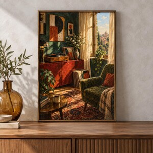 May include: A framed wall art print depicting a cozy interior scene with a green velvet armchair, a red wooden cabinet, a record player, a round coffee table with a mug, and a window view of a distant cityscape under a bright blue sky.