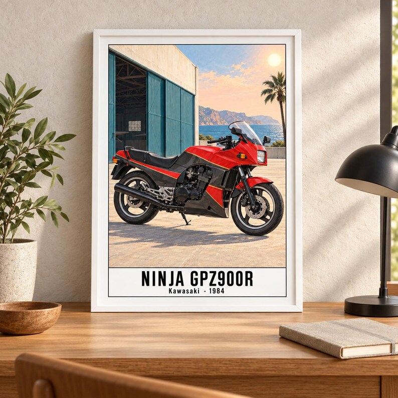 May include: A framed poster featuring a red and black 1984 Kawasaki Ninja GPZ900R motorcycle parked on a paved surface. The background shows a blue building, a palm tree, and a coastal landscape under a bright sun. The text reads NINJA GPZ900R Kawasaki 1984.