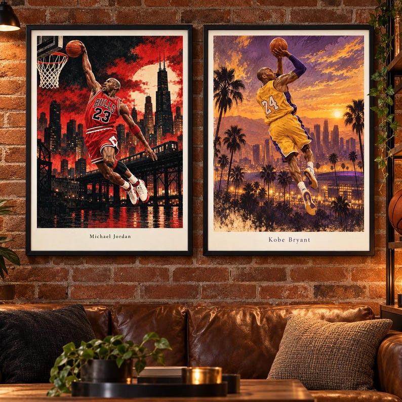May include: Two framed wall art prints featuring basketball players. The left print shows Michael Jordan in a red Chicago Bulls jersey dunking against a red city skyline. The right print shows Kobe Bryant in a yellow jersey jumping against a sunset.