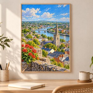 May include: A framed landscape painting depicting a town with a tall stone church spire, a river flowing under a bridge, and vibrant red flowers in the foreground. The scene is set under a bright blue sky with white clouds, capturing a scenic view.