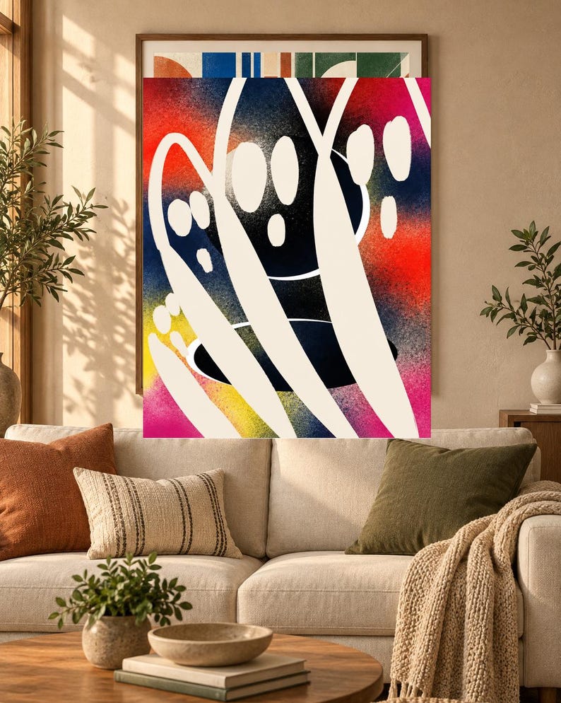 May include: A rectangular wall art print featuring a vibrant, spray-painted background with gradients of red, yellow, blue, and pink. Overlaid on the colorful base are bold, sweeping white brushstrokes and several solid white oval shapes.