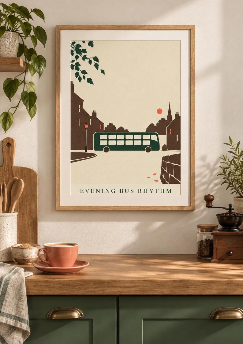 May include: A framed wall art print featuring a stylized illustration of a dark green double-decker bus on a street at dusk. The scene includes brown silhouettes of buildings, a small red sun, and tree branches. The text reads EVENING BUS RHYTHM.