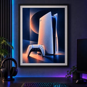 May include: A framed wall art print featuring a white PlayStation 5 console and a matching white wireless controller. The artwork displays a stylised, abstract background with circular shapes and a colour palette of deep blue, orange, and white.