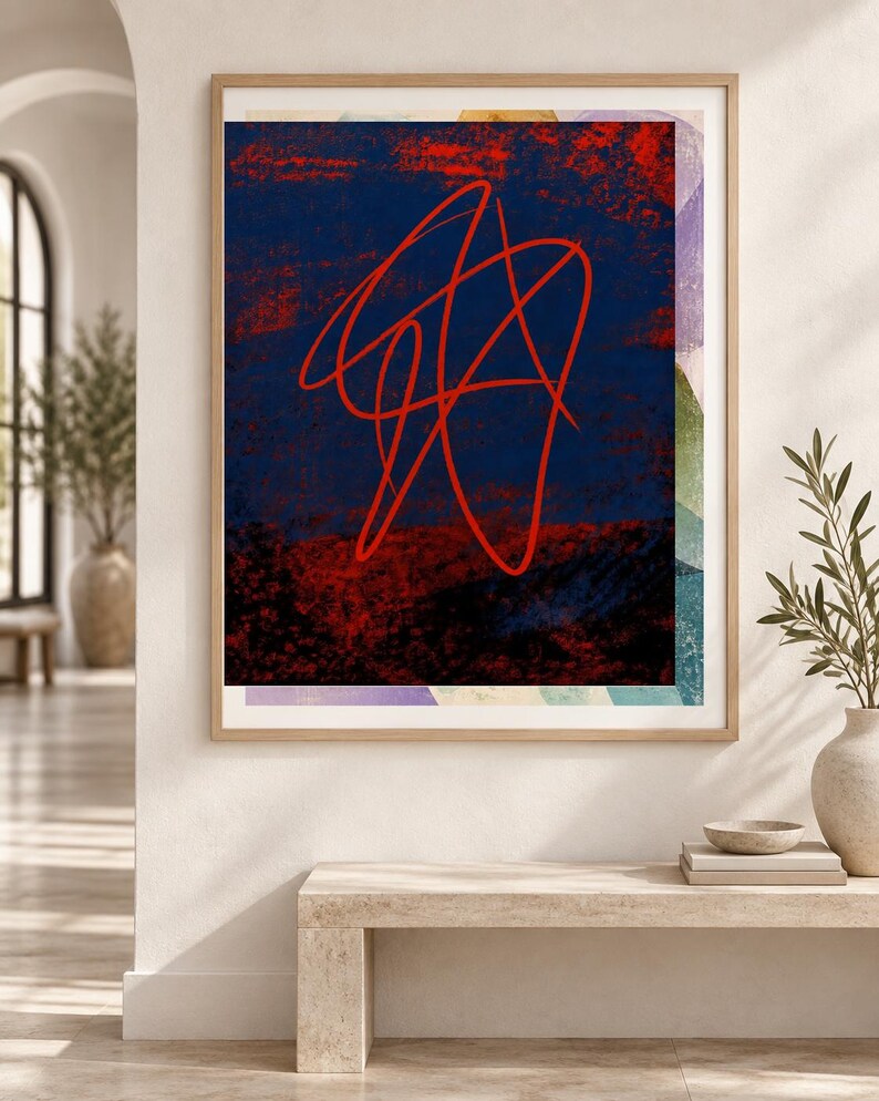 May include: A framed rectangular wall art piece featuring a dark blue and red textured background with a prominent, continuous red line drawing in the center. The artwork is enclosed in a light-toned wooden frame and displays abstract shapes.