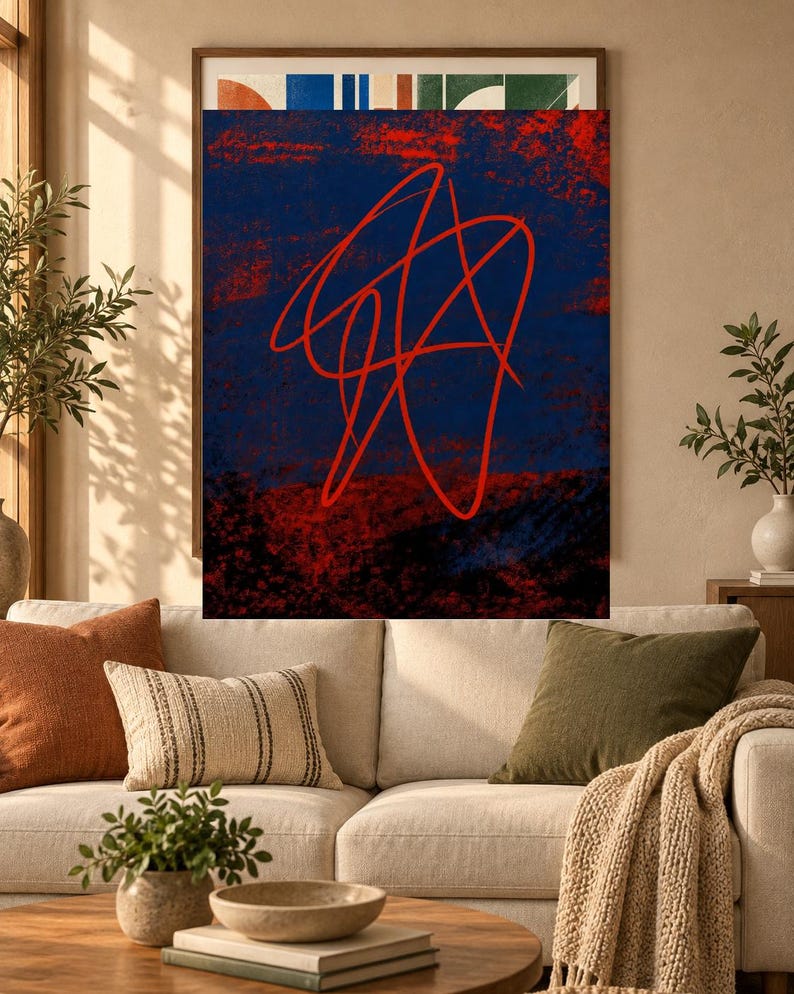 May include: A rectangular wall art piece featuring a dark blue background with textured red and black areas. A prominent, continuous red line forms an abstract, tangled scribble pattern across the center of the composition, creating a bold contrast.