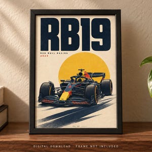 May include: A framed poster featuring a dark blue and red Formula 1 race car, the RB19, centered against a large yellow circle. The text RB19, Red Bull Racing, and 2023 are printed in dark blue and red above the car on a cream-colored background.