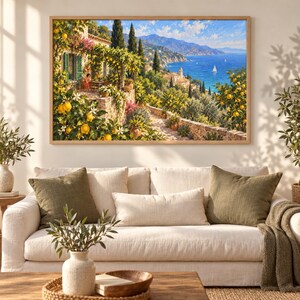 May include: A rectangular wall art print featuring a Mediterranean coastal landscape with a stone terrace, lemon trees laden with yellow fruit, lush green foliage, a villa, distant mountains, and a blue sea with sailboats under a bright sky.