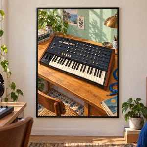 May include: A framed wall art print depicting a Korg Mono/Poly analog synthesizer resting on a wooden desk. The synthesizer features a black control panel with numerous knobs, switches, and a white and black keyboard, encased in wooden side panels.