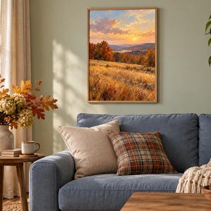 May include: A framed rectangular wall art print depicting a landscape scene with a golden sunset over rolling hills, autumn foliage in shades of orange and red, and a field of tall dry grass in the foreground, displayed in a wooden frame.
