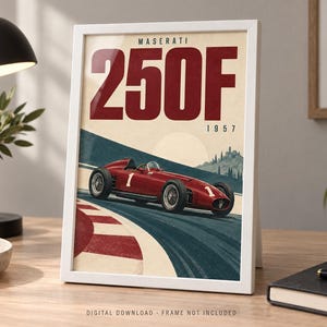 May include: A framed poster featuring a red Maserati 250F race car on a track. The text reads MASERATI 250F 1957. The car is marked with the number 1. The artwork displays a vintage style with a cream background, blue track, and red curbing.