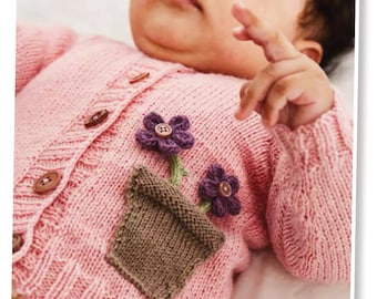 May include: A pink knitted baby cardigan with a brown knitted flower pot and purple flowers on the front.