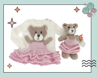 May include: A white knitted sweater with a pink ruffled skirt and a brown teddy bear applique. A smaller brown teddy bear wearing a pink ruffled dress is also pictured.