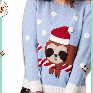 May include: A light blue sweater with a white trim and a brown sloth wearing a red Santa hat. The sweater has white polka dots and a red and white candy cane pattern.