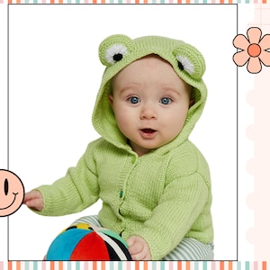May include: A baby wearing a green knitted frog hooded sweater, sitting and holding a colorful ball.