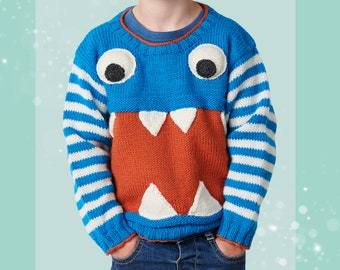 May include: A blue and white striped sweater with a monster face on the front. The monster has orange teeth and big black eyes.