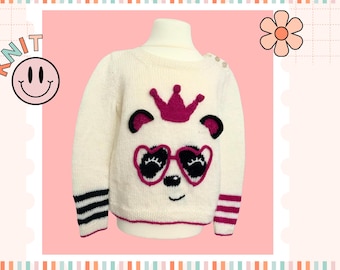 May include: White knitted sweater with a pink panda wearing a pink crown and sunglasses. The sweater has black and white stripes on the cuffs.