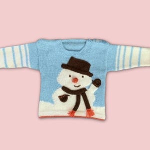 my first christmas jumper, baby christmas jumper with snowman intarsia motif wearing a top hat and scarf, christmas sweater for baby jane burns