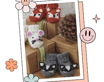 May include: Four pairs of knitted baby booties with animal faces. The booties are displayed on brown boxes with green and white ribbon. The animals include a fox, a mouse, and two raccoons.