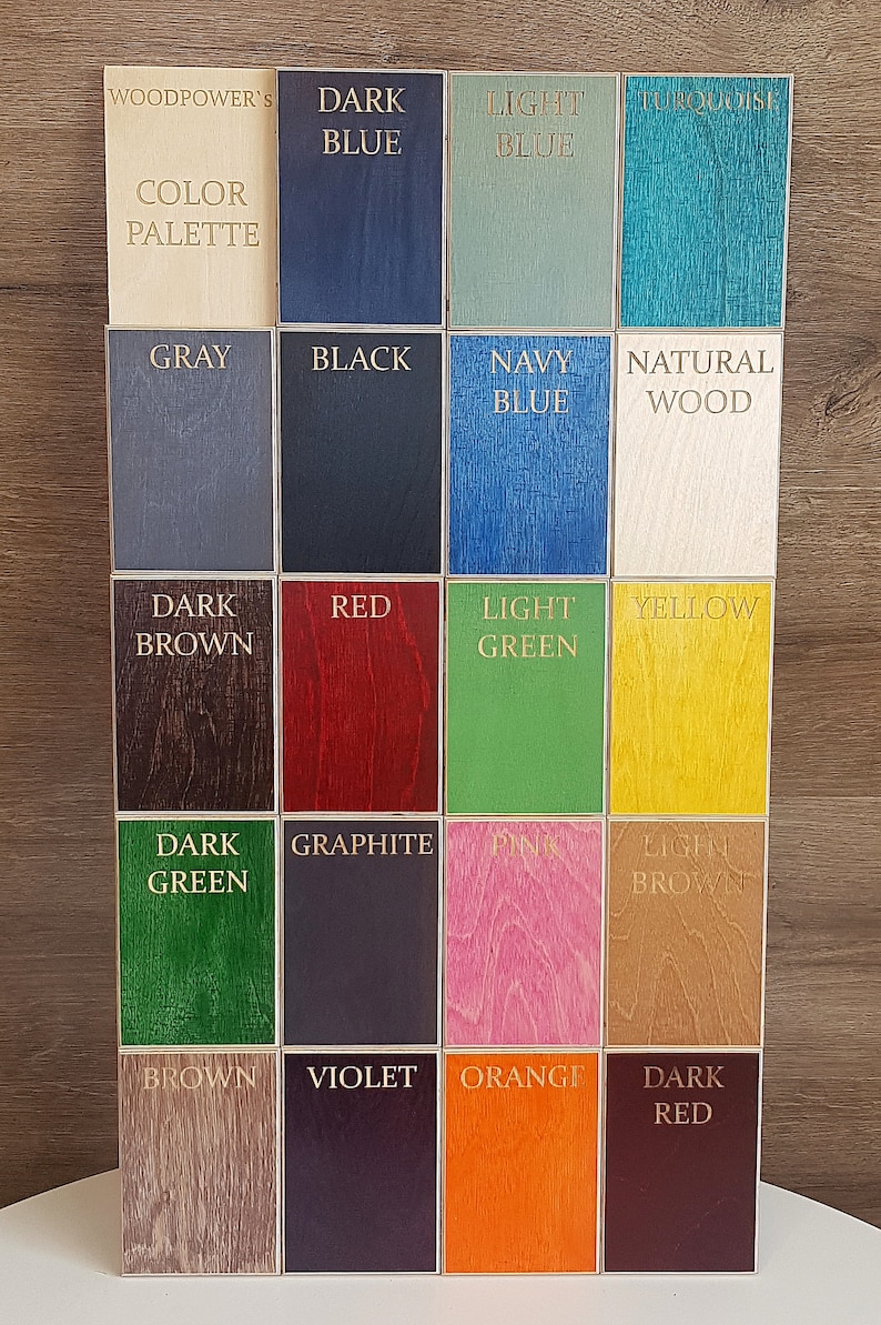 May include: Woodpower's color palette chart with 16 different wood stained colors, including dark blue, light blue, turquoise, gray, black, navy blue, natural wood, dark brown, red, light green, yellow, dark green, graphite, pink, light brown, brown, violet, orange, and dark red.