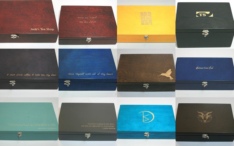 May include: Twelve wooden boxes with various colors and engraved text. The boxes have a hinged lid and a metal clasp. The text on the boxes includes quotes, names, and a logo.