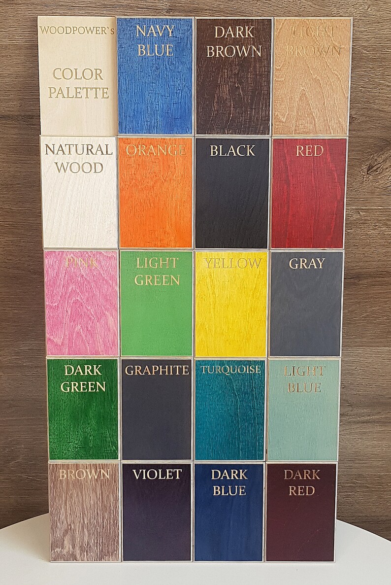 May include: A color palette chart with 18 different wood samples stained in various colors, including navy blue, dark brown, light brown, orange, black, red, pink, light green, yellow, gray, dark green, graphite, turquoise, light blue, brown, violet, dark blue, and dark red.