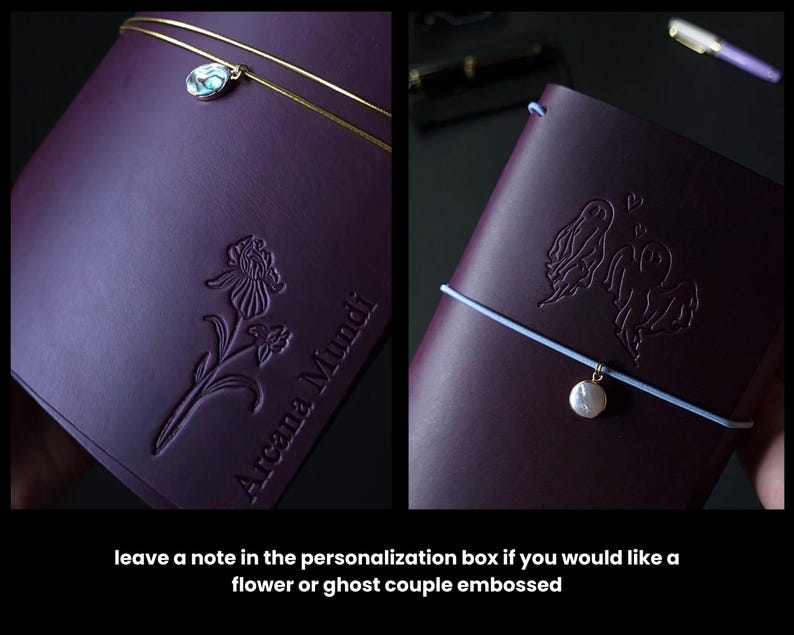 May include: Two dark purple leather journals with embossed designs. One features a flower, the other a ghost couple. Each has a charm and elastic closure. The text "Arcana Mundi" is embossed on one. The image also includes the text: "leave a note in the personalization box if you would like a flower or ghost couple embossed."