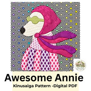 May include: A digital PDF Kinusaiga pattern titled Awesome Annie featuring a stylized dog wearing a pink headscarf, green glasses, and a flowing purple scarf. The dog has a white face, black nose, and a dress with pink and purple diamond patterns.