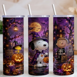 May include: Three cylindrical tumblers with white straws featuring a Halloween theme. The design displays Snoopy in a purple witch hat, Woodstock on a pumpkin, and a character in a skeleton costume, set against a purple night sky with a full moon.