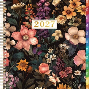May include: A 2027 spiral-bound planner featuring a black cover with a dense, colorful floral pattern of pink, orange, yellow, and purple flowers and green foliage. The year 2027 is printed in a white rectangular box. Includes monthly side tabs.