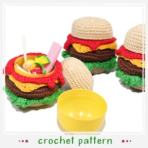 May include: Three crocheted hamburger-shaped containers with a yellow plastic container lid. The containers are filled with candy and a pink stick. The containers are on a white surface. crochet pattern